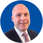 Man in a suit and tie with a blue background