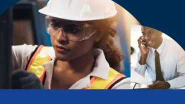 Female engineer in hard hat, another person talking on phone.