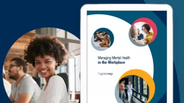 Smiling woman beside tablet with 'Managing Mental Health in the Workplace' cover.
