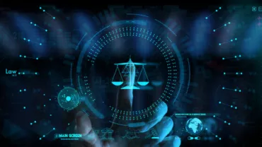 Futuristic digital interface with scales of justice in the center.