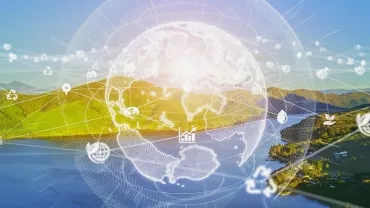 Digital globe over a scenic landscape with icons of sustainability and technology.