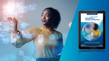 Person interacting with digital screens next to a technology guide on a tablet.
