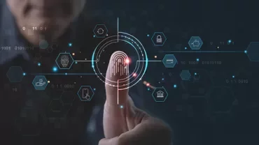 Person using biometric fingerprint scanning on a digital interface.