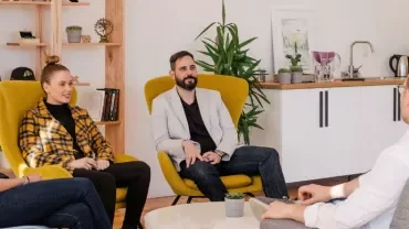 Group of people having a meeting in a modern office space.