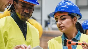 Group of construction workers discussing a project.