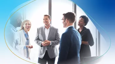Group of professionals having a discussion in a bright office.
