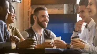 A group of colleagues having a cup of coffee 