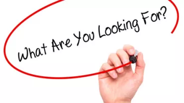 Text saying 'What Are You Looking For?' inside a red circle.