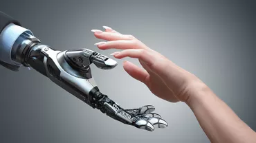A robotic and a human hand reaching out to each other.