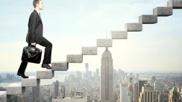 Businessman climbing floating stairs above city skyline.