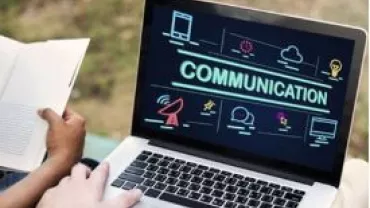 Laptop screen displaying the word 'Communication' with various icons around it.