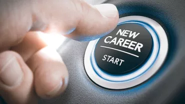 Hand pressing a button labeled 'new career start.'