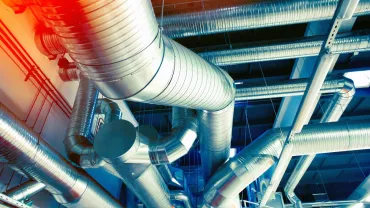 Network of metal air ducts in an industrial building