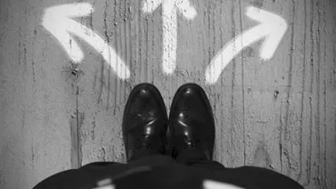 Top view of feet on concrete with three arrows pointing left, right, and forward.