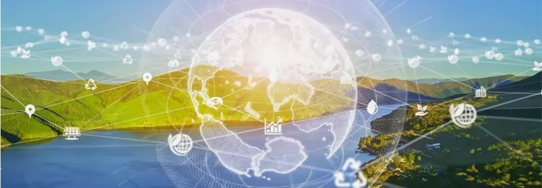 Digital globe over a scenic landscape with icons of sustainability and technology.