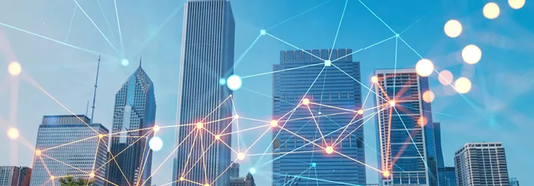 City skyline with abstract network lines overlaying tall skyscrapers.