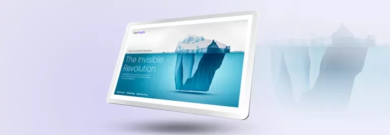 Digital display showing an iceberg with the text 'The Invisible Revolution' on screen.