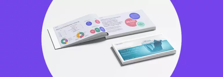 Open book with charts, next to a book cover titled 'The Invisible Revolution'.