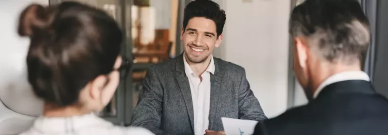 Two people interviewing for a job and are well presented 