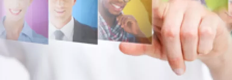 Person pointing at floating profile pictures of diverse individuals.