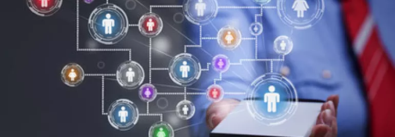 Person holding a smartphone displaying a network of connected icons symbolizing social connectivity.