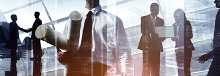 Business professionals and an engineer with blueprints in a cityscape background.