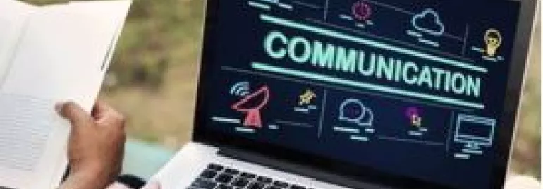 Laptop screen displaying the word 'Communication' with various icons around it.