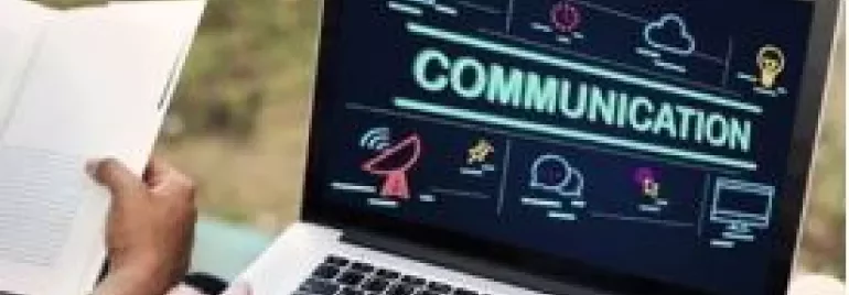 Laptop screen displaying the word 'Communication' with various icons around it.