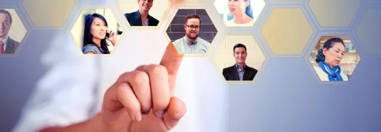 Person touching digital hexagonal interface with portraits.