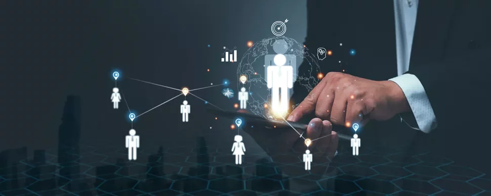 Hand interacting with a digital network of people icons