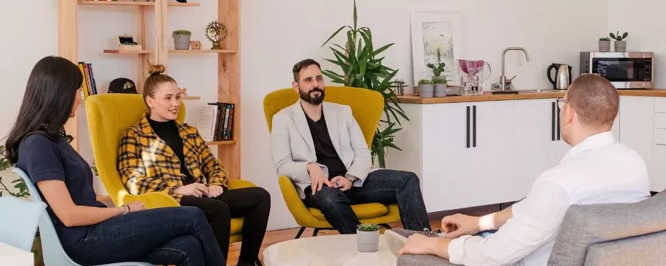 Group of people having a meeting in a modern office space.