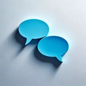 Blue speech bubble icons on a light background, symbolizing communication and dialogue