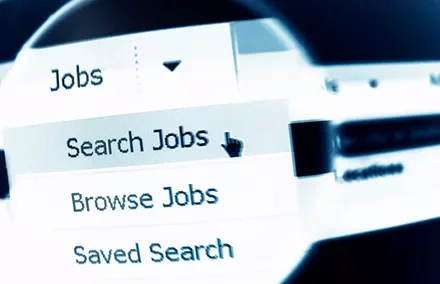 Close-up of a computer screen showing a menu with options: Search Jobs, Browse Jobs, Saved Search.